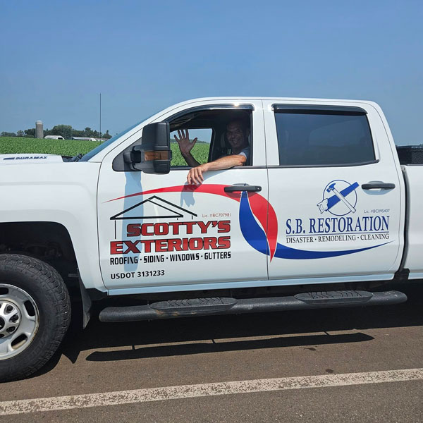 Scotty's Exteriors / SB Restoration truck on the road
