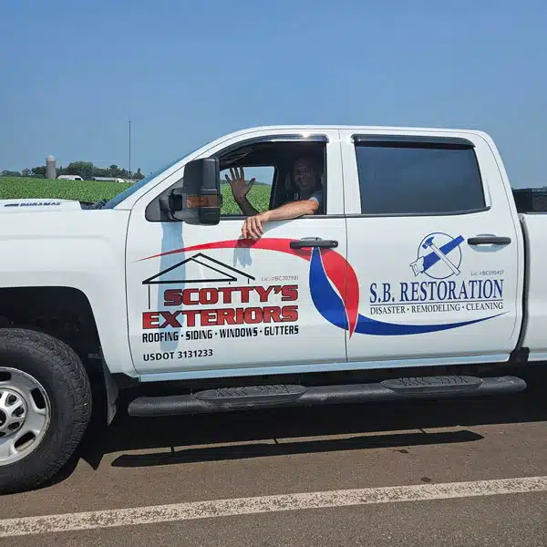 Scotty's Exteriors / SB Restoration truck on the road
